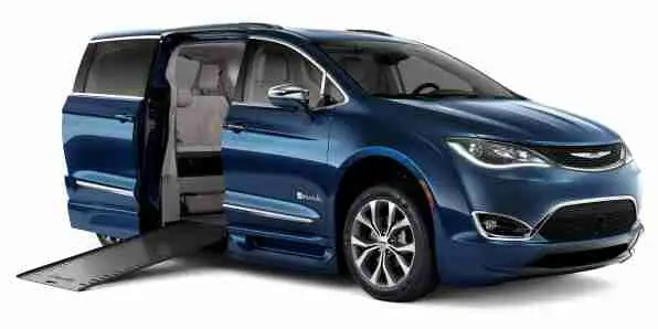 Image of a true blue Chrysler Pacifica wheelchair van from BraunAbility with its ramp out