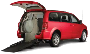 Image of a red Dodge Caravan wheelchair van with a rear-entry conversion