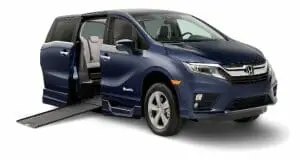 Image of a blue Honda Odyssey wheelchair van with its ram out