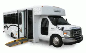 Image of a white paratransit bus with wheelchair lift