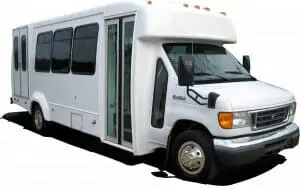 Image of a white paratransit bus