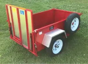 Image of a Scootatrailer sitting in the grass without the optional enclosed top