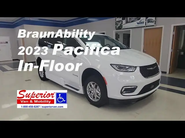 White chrysler pacifica wheelchair van with in-floor conversion in a building