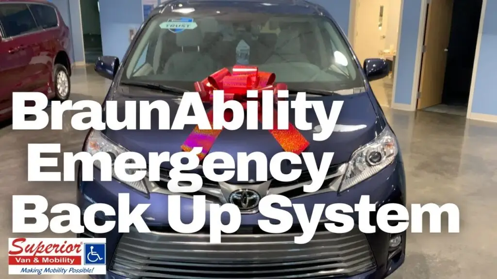 BraunAbility emergency back up system over a photos of a blue wheelchair van with a red bow on the hood