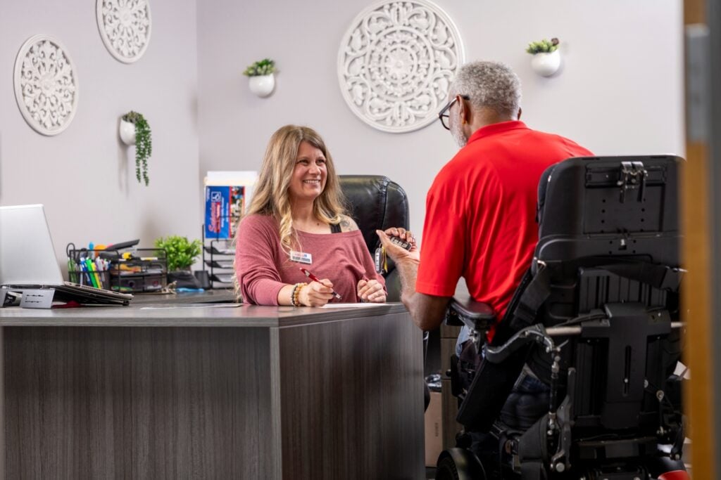 Mobility consultant helping customer choose an accessible vehicle