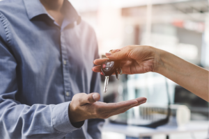 handing car keys over to a man