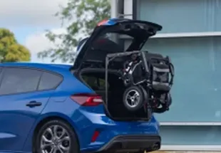 surelift 88 loaded into back of blue hatchback