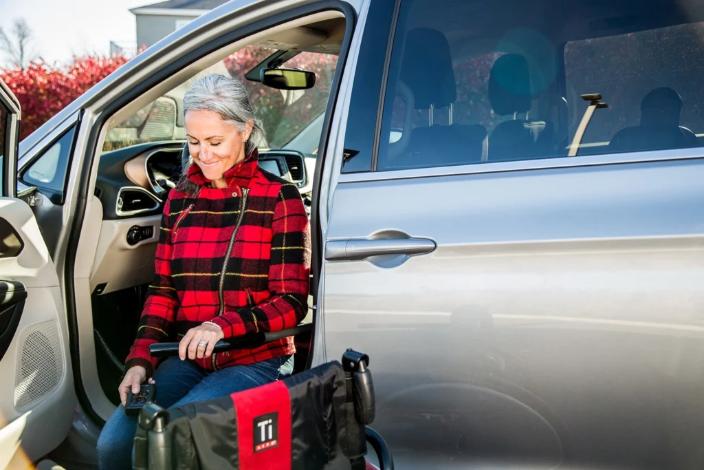 women in transfer seat entering her van