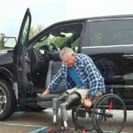 man exiting wheelchair to sit in turny evo seat