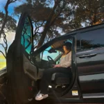 woman exiting vehicle in link 2.0 seat