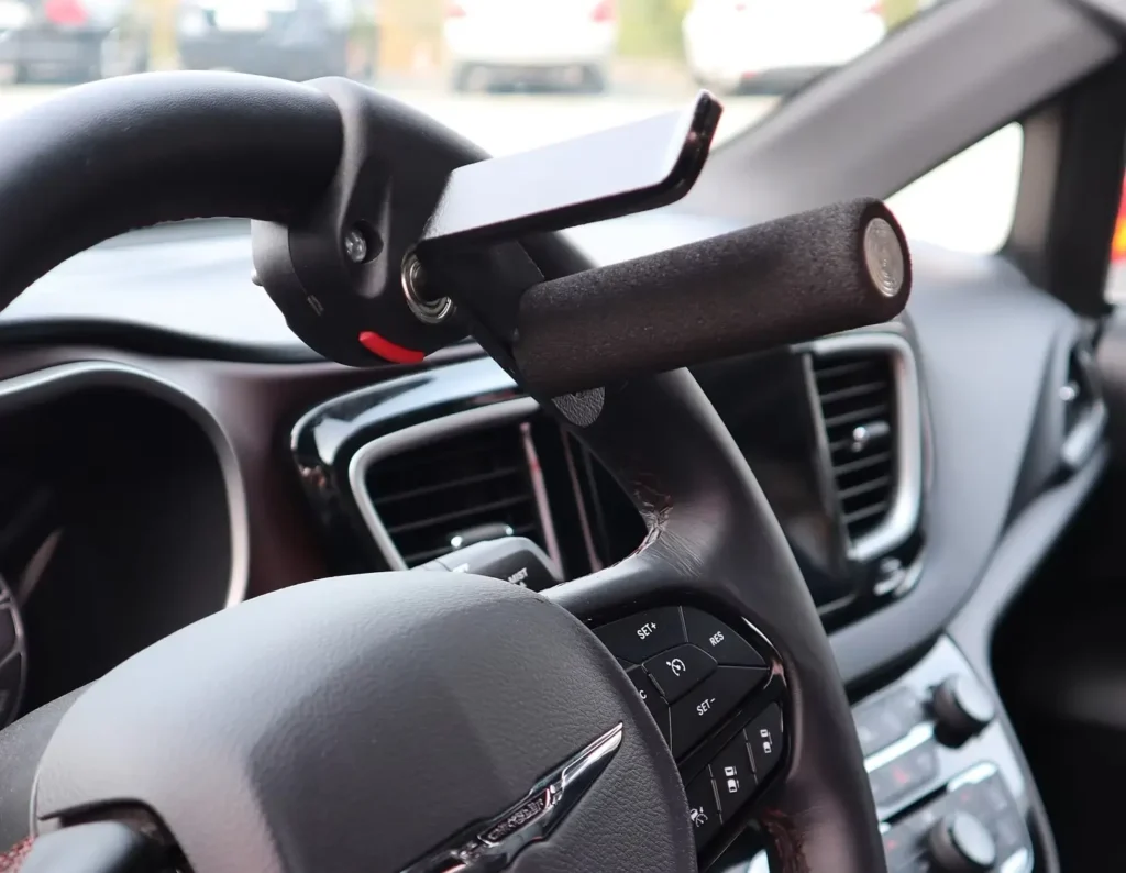 v-grip hand control attached to steering wheel